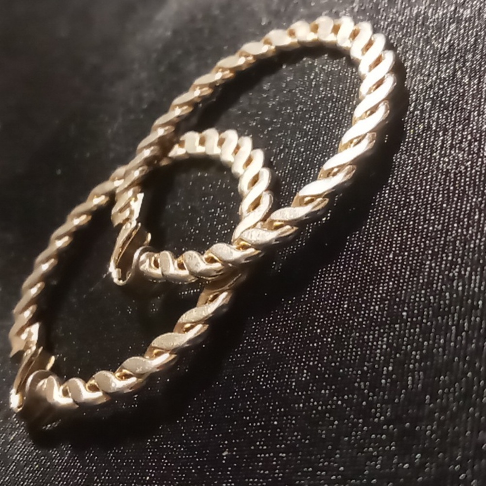 Vintage clip on flattened twisted cable earrings L.H segal California signed.
